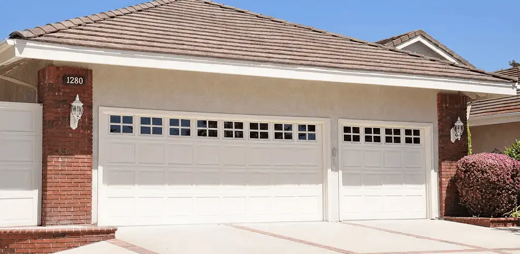 Residential garage door repair service for a double garage door in West Palm Beach, FL